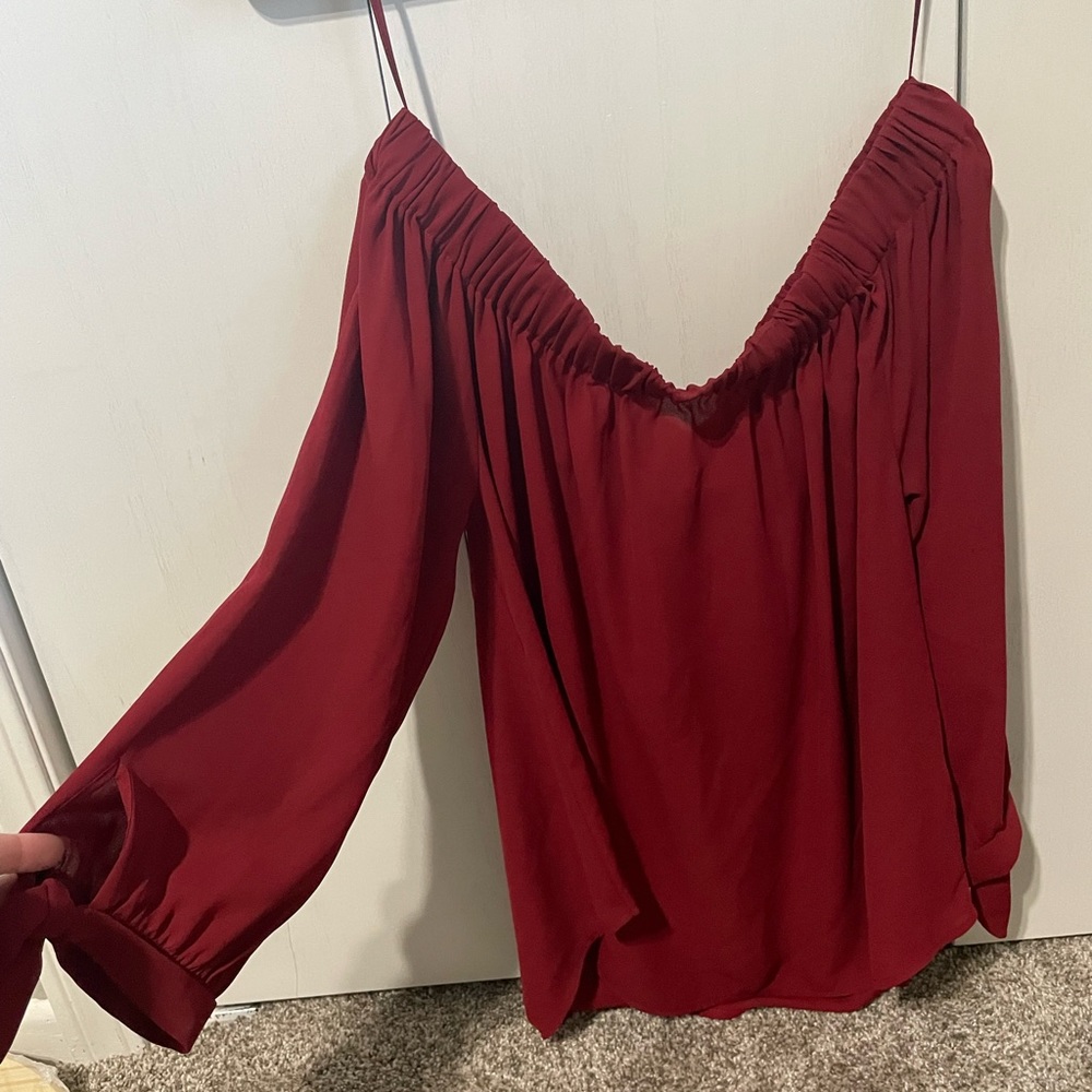 Express off the shoulder red shirt with tie sleeves that are 3/4 length. Size S